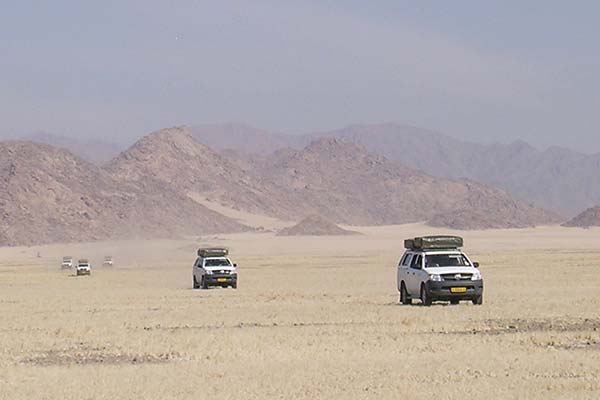 Caravan of trucks in the desert
